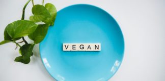 Vegan diet scrabble tiles in blue ceramic plate