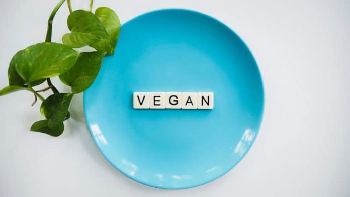 Vegan diet scrabble tiles in blue ceramic plate