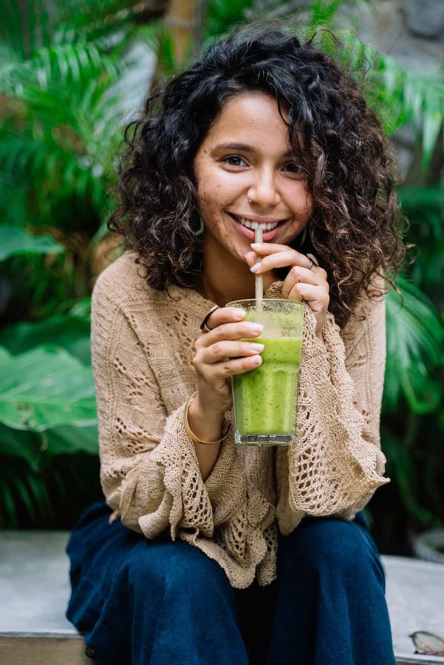 Nutrition During Fasting: Woman In Beige Knitted Sweater Holding A Healthy Drink