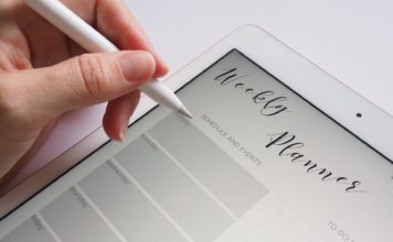 Person Holding White Stylus